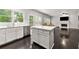 Open-concept kitchen with a center island, stainless steel appliances, and eat-in dining space at 7505 Brookwood Way, Cumming, GA 30041