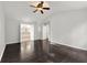 Main bedroom boasts hardwood floors, a ceiling fan, and an ensuite bathroom at 7505 Brookwood Way, Cumming, GA 30041