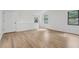Bright bedroom featuring hardwood floors, fresh white paint and a private door at 9165 Eves Cir, Roswell, GA 30076