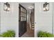 Open front door revealing a staircase and beautiful herringbone hardwood floors at 9165 Eves Cir, Roswell, GA 30076