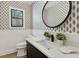 Stylish powder room with modern wallpaper, updated fixtures, and a floating vanity at 9165 Eves Cir, Roswell, GA 30076