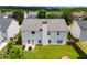 Aerial view showcasing the home's backyard, featuring a lush lawn and privacy fence at 105 Lanier Xing, Hiram, GA 30141