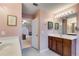 Bathroom showing vanity with mirror, lighting, and doorway to another room at 105 Lanier Xing, Hiram, GA 30141