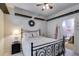 Bedroom with a bed, nightstand, and access to an en-suite bathroom at 105 Lanier Xing, Hiram, GA 30141