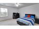 Bedroom with blue accents, desk, ceiling fan and bright window at 105 Lanier Xing, Hiram, GA 30141
