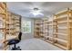 Large custom walk-in closet with extensive built-in shelving providing ample storage and organization at 105 Lanier Xing, Hiram, GA 30141