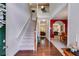 Inviting foyer with hardwood floors, staircase, and views into the dining and living areas at 105 Lanier Xing, Hiram, GA 30141