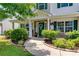 Charming front porch with stone accents, lush greenery, and a welcoming entrance at 105 Lanier Xing, Hiram, GA 30141