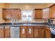 Kitchen featuring dark countertops, stainless steel appliances, and wood cabinets at 105 Lanier Xing, Hiram, GA 30141