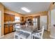 Kitchen with wooden cabinets, stainless steel appliances, and an island with seating at 105 Lanier Xing, Hiram, GA 30141