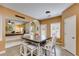 Eat-in kitchen area features a wooden island with seating and a view into the living area at 105 Lanier Xing, Hiram, GA 30141