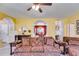 Bright living room featuring comfortable furniture and an open view to the dining area at 105 Lanier Xing, Hiram, GA 30141