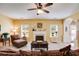 Cozy living room with a fireplace, plush seating, and a bright, inviting atmosphere at 105 Lanier Xing, Hiram, GA 30141