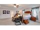 A spacious main bedroom features a four-poster bed, sitting area, and ensuite bathroom at 105 Lanier Xing, Hiram, GA 30141