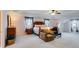 This is a main bedroom with light pink walls, carpet, a four-poster bed and ceiling fan at 105 Lanier Xing, Hiram, GA 30141