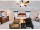 This is a main bedroom with light pink walls, carpet, a four-poster bed and ceiling fan at 105 Lanier Xing, Hiram, GA 30141