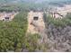 Aerial view showcasing property with lush surrounding greenery and landscaping at 172 Lakeview Dr, Newborn, GA 30056