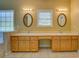 Spacious primary bathroom with double vanity, framed mirrors, and ample countertop space at 172 Lakeview Dr, Newborn, GA 30056