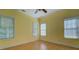 Bright bedroom features wood-look floors, multiple windows, a ceiling fan, and neutral trim at 172 Lakeview Dr, Newborn, GA 30056