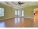 Large primary bedroom with ceiling fan, wood flooring, and access to the porch and Gathering room at 172 Lakeview Dr, Newborn, GA 30056