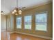 Dining area with chandelier lighting, large windows, and natural light at 172 Lakeview Dr, Newborn, GA 30056