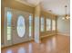 Bright foyer featuring hardwood floors, decorative door, and ample natural light at 172 Lakeview Dr, Newborn, GA 30056