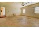 Spacious garage with a utility sink, windows, and an interior entry door at 172 Lakeview Dr, Newborn, GA 30056
