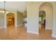 Open-concept living room with hardwood floors and arched doorways at 172 Lakeview Dr, Newborn, GA 30056