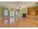 Spacious living room with a fireplace, built-in shelving, and tray ceiling at 172 Lakeview Dr, Newborn, GA 30056
