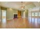 Bright living room with fireplace, built-in shelving, and hardwood floors at 172 Lakeview Dr, Newborn, GA 30056