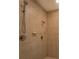 Walk-in shower featuring tile surround, chrome fixtures, and an adjustable shower head at 172 Lakeview Dr, Newborn, GA 30056