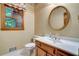 Bright bathroom featuring classic fixtures, a vanity and natural light from a window at 2935 Abbottswell Dr, Alpharetta, GA 30022