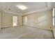 Bright, carpeted bedroom with a tray ceiling and plenty of natural light at 2935 Abbottswell Dr, Alpharetta, GA 30022