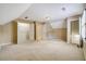 Large bedroom with plush carpet, closet, and dormer window, offering plenty of room for relaxation and storage at 2935 Abbottswell Dr, Alpharetta, GA 30022