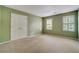 Comfortable bedroom with neutral carpet and walls, and natural light from the windows, a perfect space for rest at 2935 Abbottswell Dr, Alpharetta, GA 30022
