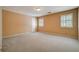 Bright bedroom with neutral walls, plush carpet, and natural light from the windows, creating a cozy atmosphere at 2935 Abbottswell Dr, Alpharetta, GA 30022
