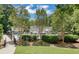 View of the community pool and lounge area surrounded by lush trees and greenery at 2935 Abbottswell Dr, Alpharetta, GA 30022