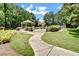 Community area featuring a gazebo and scenic walking paths in a lush, green setting at 2935 Abbottswell Dr, Alpharetta, GA 30022