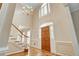 Elegant foyer with high ceilings, chandelier, hardwood floors, and staircase at 2935 Abbottswell Dr, Alpharetta, GA 30022