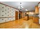 Open kitchen area showcasing hardwood floors, an island and generous cabinet space at 2935 Abbottswell Dr, Alpharetta, GA 30022