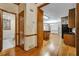 Elegant hallway providing entry to the kitchen area and featuring beautiful hardwood floors at 2935 Abbottswell Dr, Alpharetta, GA 30022