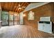 Large covered porch featuring a ceiling fan and wooded views at 2935 Abbottswell Dr, Alpharetta, GA 30022