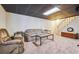 Relaxing basement area featuring cozy seating, and a staircase, perfect for entertaining at 3212 Georgian Woods Cir, Decatur, GA 30034