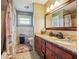 Bathroom with double sinks, tile floor, and bath tub at 3212 Georgian Woods Cir, Decatur, GA 30034