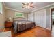 Bedroom with hardwood floors, windows, and bed at 3212 Georgian Woods Cir, Decatur, GA 30034
