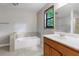 Bathroom featuring a large vanity, tile floors, and combo tub and shower with glass doors at 3442 Winter Wood Trl, Marietta, GA 30062
