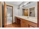 Spacious bathroom featuring a vanity with sink and a separate area with a bathtub and tile surround at 3442 Winter Wood Trl, Marietta, GA 30062