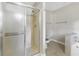 Walk-in shower with tiled walls, glass door, and a view of the adjacent toilet and vanity at 3442 Winter Wood Trl, Marietta, GA 30062