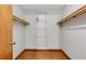 Walk-in closet with wood-style laminate floors, wire shelving, and door for easy access at 3442 Winter Wood Trl, Marietta, GA 30062