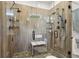 Luxurious walk-in shower featuring dual shower heads and stylish wood look tile surround at 411 Johnson Rd, Locust Grove, GA 30248
